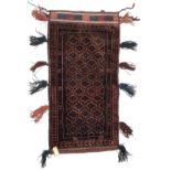 A Belouch Balisht tent bag, the charcoal field with rows of hooked guls within three borders,