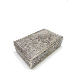 A Chinese repousse decorated cigarette box, the lid with birds perched in flowering branches,