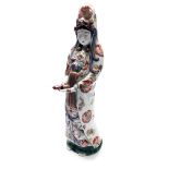 A Japanese porcelain figure of Guanyin, Meiji period, standing holding a scroll,