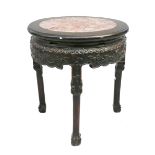 A Chinese hardwood jardiniere stand, 19th century, with a circular marble inset top,