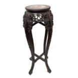 A Chinese hardwood tall jardiniere stand, circa 1880, with inset circular marble top,