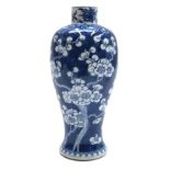 A Chinese blue and white prunus blossum baluster vase, circa 1900, with four character Kangxi mark,