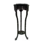 A Chinese carved ebonised jardinere stand, 19th century,