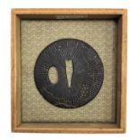 A Japanese gilt metal decorated tsuba, diameter 7cm, with wooden box.