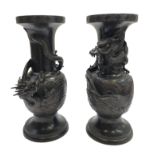 A pair of Japanese bronze vases, Meiji period, each decorated with dragons,