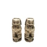 A matched pair of Chinese ivory buddhist lion dogs, early 20th century, with seal marks, height 15.