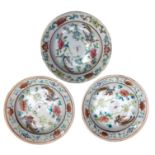 A set of three Chinese famille rose dishes, each with floral sprays and stylised birds,