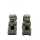 A pair of Chinese jadeite dogs of fo, 20th century, height 15cm, width 6cm.