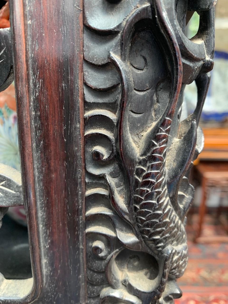 A Chinese carved ebonised display cabinet, 19th century, - Image 10 of 21