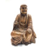 A Chinese carved wood figure of a seated buddha, height 36cm, width 24cm, depth 16.5cm.