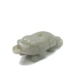 A Chinese carved jade water pot in the form of a kirin, 19th century, height 4.5cm, length 11cm.