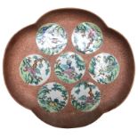 A Japanese stoneware dish, circa 1900, decorated with seven porcelain medallions, signed, 26.