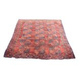 An Ersari carpet, the madder field with six rows of three octagonal medallions,