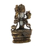 A Chinese jade and gilt metal bronze of a Buddhist deity, with headdress, axe and sceptre,