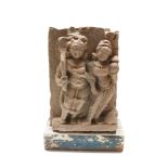 A South East Asian carved stone relief panel, 19th century, depicting two standing figures,