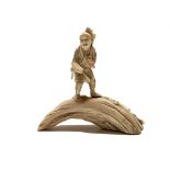 A Japanese ivory okimono of a woodcutter, Meiji Period, height 11.5cm, width 12cm.