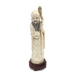 A Chinese ivory figure of Shou Xing the God of Longevity, circa 1900-1920,