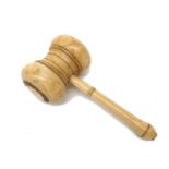 A Victorian turned ivory gavel, height 6cm, length 13cm.