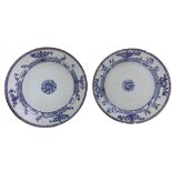 A near pair of Chinese porcelain blue and white plates, 18th century, each with floral sprays,