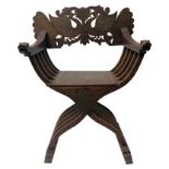 A Syrian savanarola brass inlaid armchair, 19th century, the back carved with peacocks,