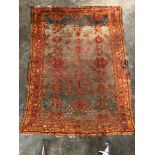An Ushak Turkish carpet, the blue abrash field with an all over design of serrated leaves,