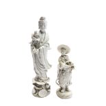 Two Chinese blanc de chine figures, one of Guanyin holding a lotus flower and standing on a plinth,