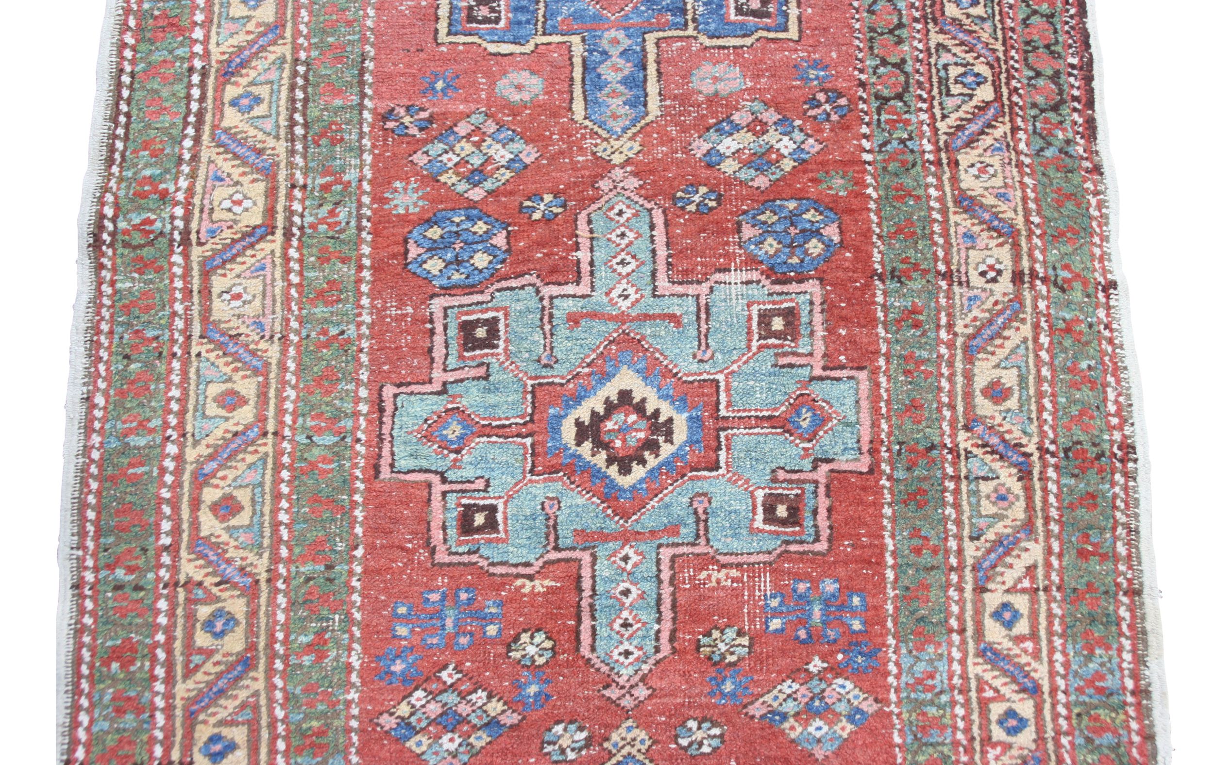 A Heriz runner, North West Persia, the madder field with seven indigo and pale blue medallions, - Image 6 of 10
