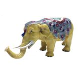 A porcelain figure of an elephant, circa 1900, possibly Samson of Paris,