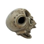 A Japanese carved ivory model of a skull, Meiji period, height 3.5cm.