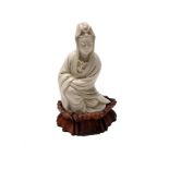 A Chinese blanc de chine Dehua Guanyin, early 20th century, with the mark of He Chaozong,
