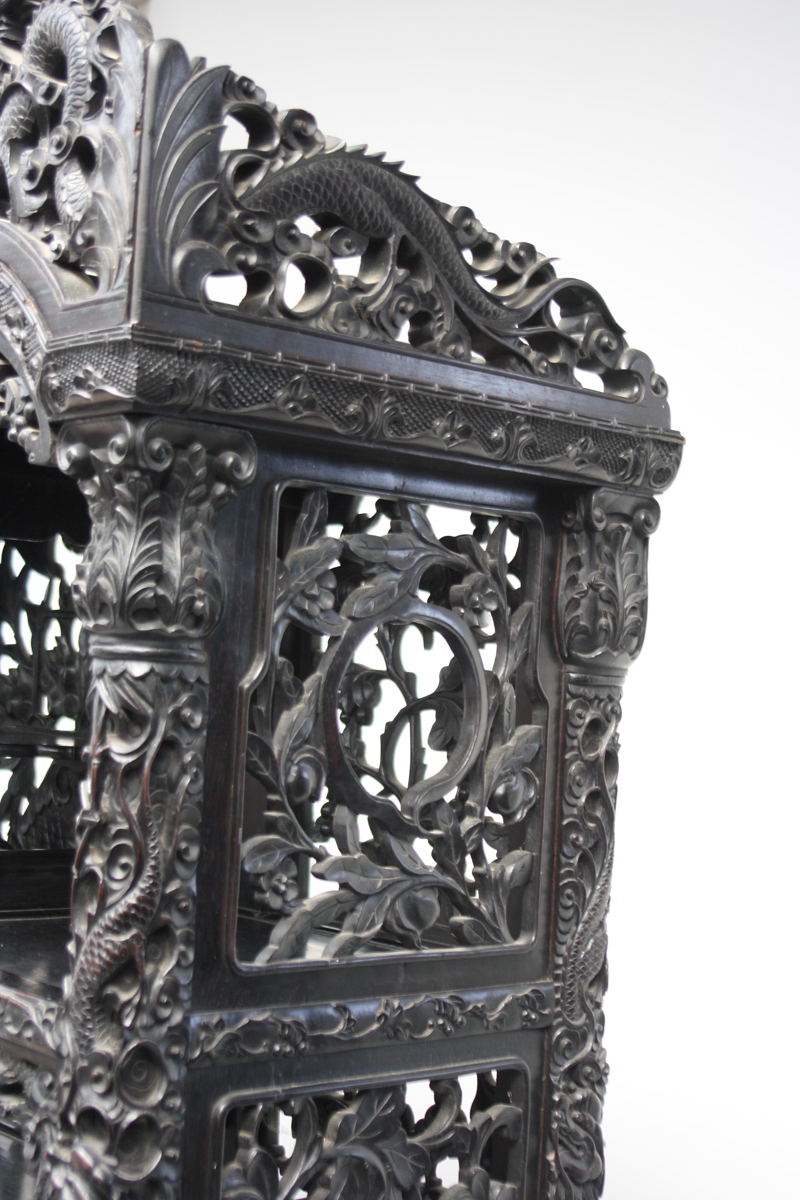 A Chinese carved ebonised display cabinet, 19th century, - Image 2 of 21