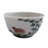 A Chinese porcelain tea bowl, 18th century, the body decorated with birds, bamboo and plants,