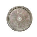 An Indian brass and copper circular tray, with central white metal roundel, diameter 60.