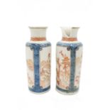 A pair of Chinese porcelain cylindrical vases, Qing period, early 18th century,