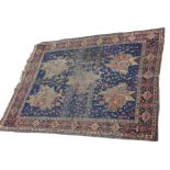 An Afshar rug, South West Persia, the indigo field with five polychrome medallions with guls, vines,