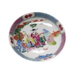 A Chinese famille rose dish, 20th century, with figures beneath a tree, six character mark,