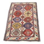 A Kazak rug, South West Caucasus, with five rows of two hooked polychrome medallions,