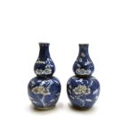 A pair of Chinese prunus pattern double gourd vases, late 19th century, height 16cm.