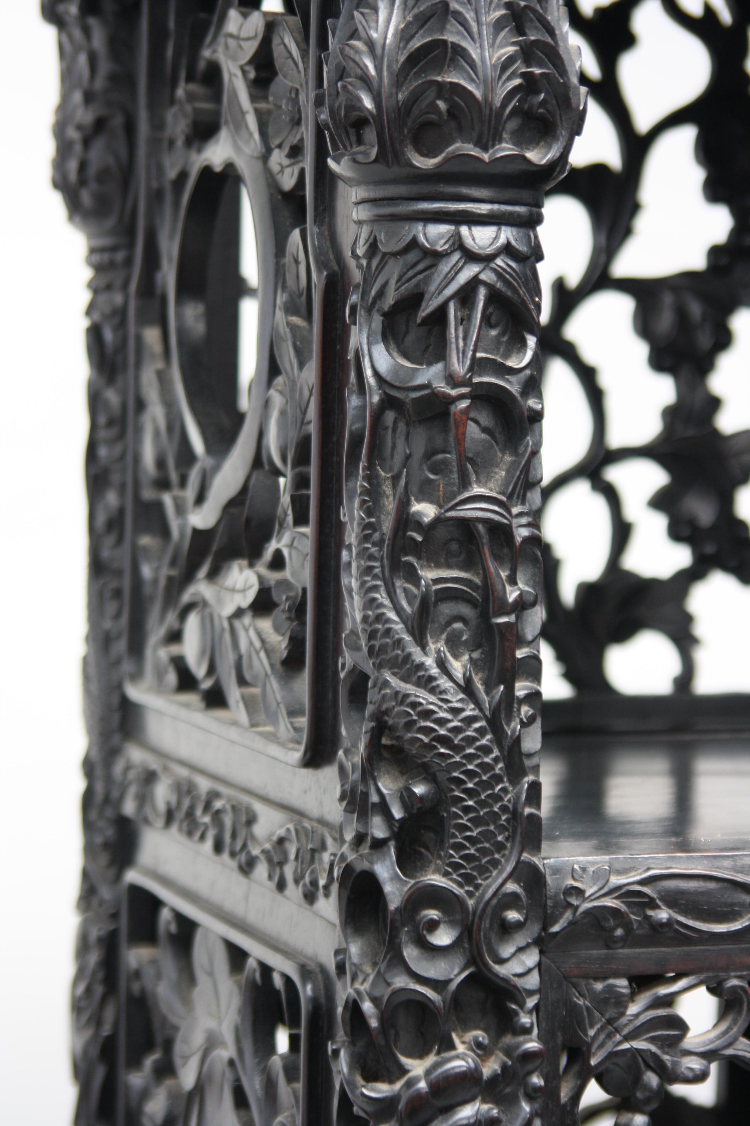 A Chinese carved ebonised display cabinet, 19th century, - Image 8 of 21