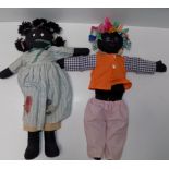 Two fabric black dolls.