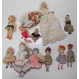 A collection of six porcelain and six celluloid miniature dolls.