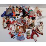 A collection of costume dolls to include a Steiff cat.