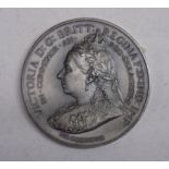 An 1897 Queen Victoria Jubilee Army and Navy token.