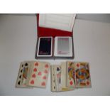 A complete pack of early 20th century playing cards and a Concorde twin pack of playing cards.