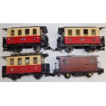 Three Marklit 2" gauge carriages and one other carriage.