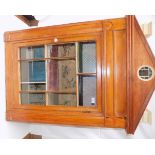 A wood dolls house converted from a 19th century glazed cabinet, full height 50", separate stand.