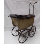 A 1920s childs dolls pram with porcelain handle, full height 30".