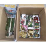 Meccano:- a box of many cogs, wheels, small plates, hooks, hundreds,