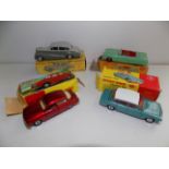 Dinky :- 132 Packard, 150 Rolls-Royce, 135 Triumph 2000 and 156 Saab 96, each in damaged box.