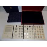 A wood coin case, one other and "The 50 State Quarter Series" lacks one.